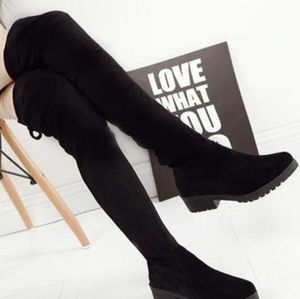 Black long knee boots with medium heels